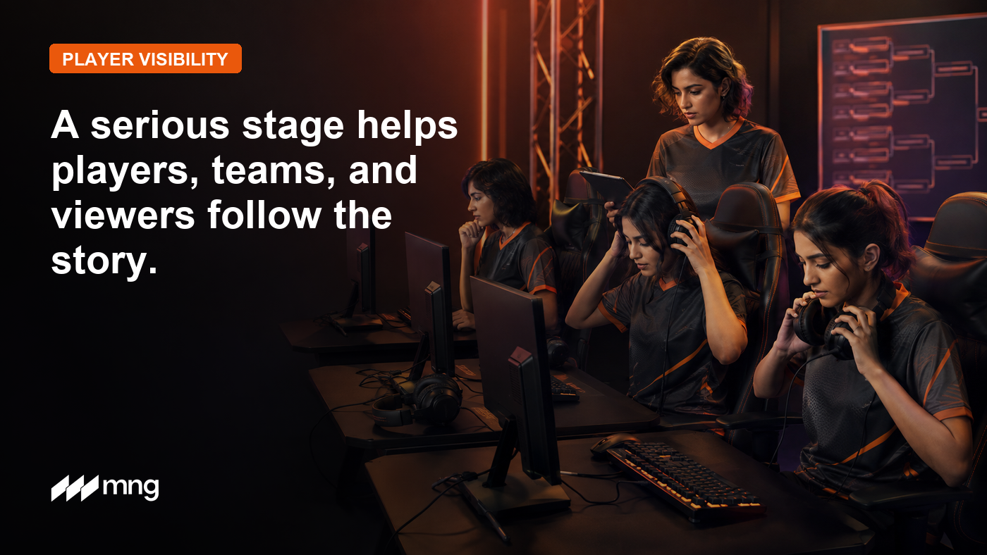 Women esports players preparing at a tournament stage with Momentum Gaming branding.
